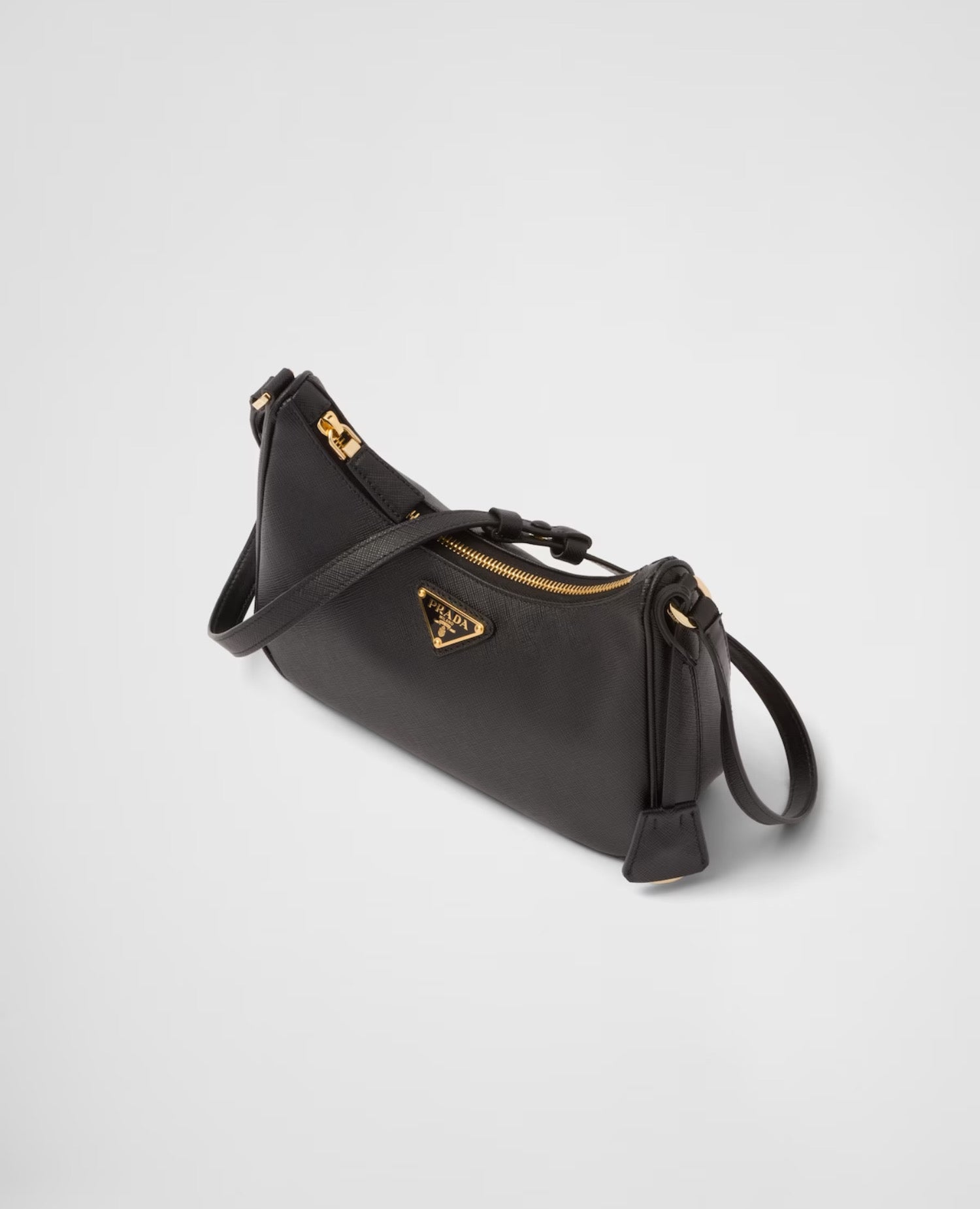 حقيبة Prada Re-Edition من جلد سافيانو صغيرة